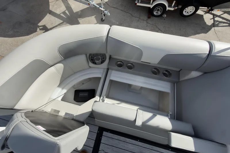 Slide: The Image of 2026 Montara Surf Boss 2.0 SL 23" boat interior with gray seating and open engine compartment. - 32