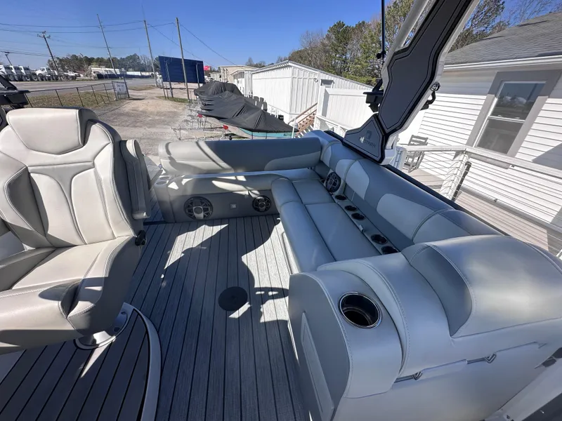 Slide: The Image of 2026 Montara Surf Boss 2.0 SL 23" boat interior with gray seating and cup holders. - 8