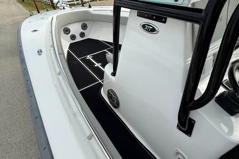 Slide: The Image of 2022 Cape Horn 31 T boat interior with Suzuki 350 engines, featuring seating and storage. - 12