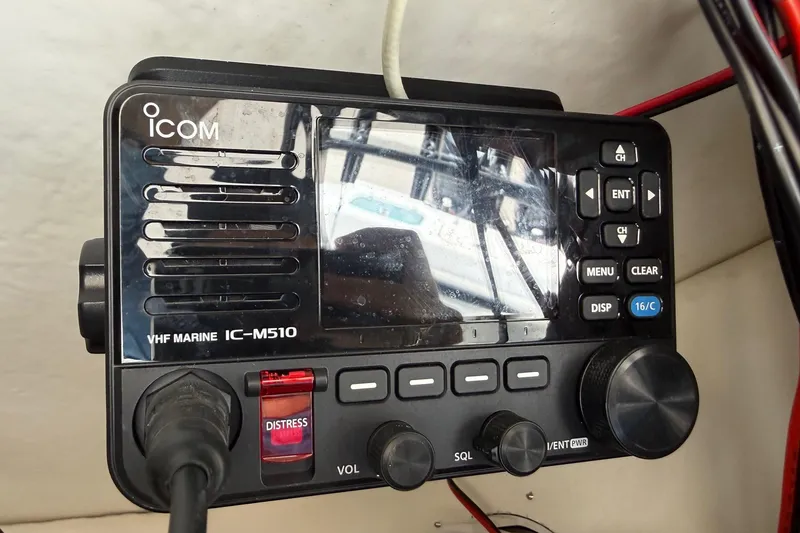 Slide: The Image of 2022 Cape Horn 31 T boat with spacious deck and seating, docked near a fence. - 20