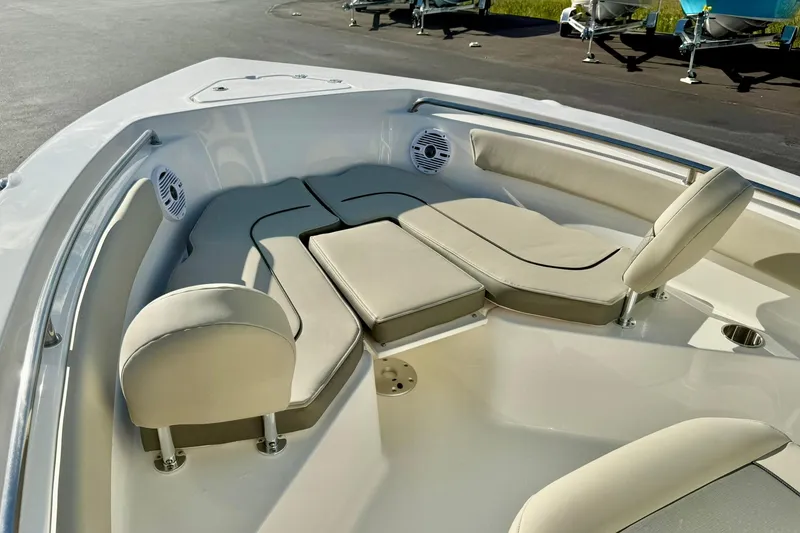 Slide: The Image of 2026 Key West 203 FS boat interior with cushioned seating and speakers. - 12