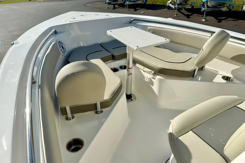 Slide: The Image of 2026 Key West 203 FS boat interior with seating and table setup. - 13