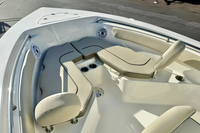 Slide: The Image of 2026 Key West 203 FS boat interior with cushioned seating and cup holders. - 14