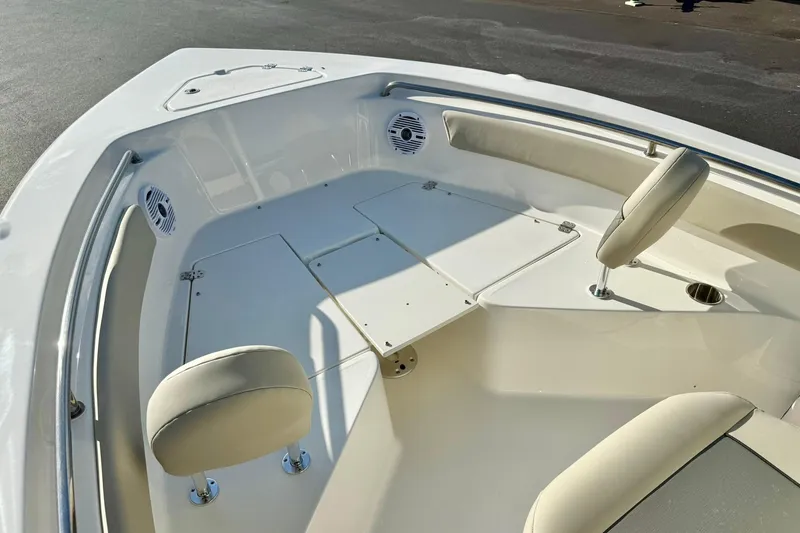 Slide: The Image of 2026 Key West 203 FS boat interior with seating and speakers. - 15