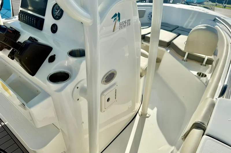 Slide: The Image of 2026 Key West 203 FS boat interior with console, seating, and cup holders. - 22
