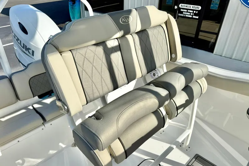 Slide: The Image of 2026 Key West 203 FS boat seating with Suzuki engine in showroom. - 24