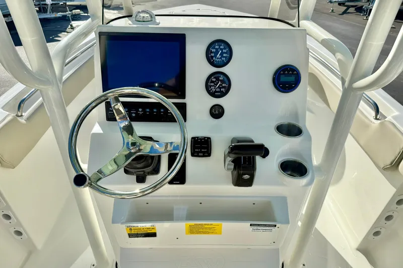 Slide: The Image of 2026 Key West 203 FS boat dashboard with steering wheel and gauges. - 3