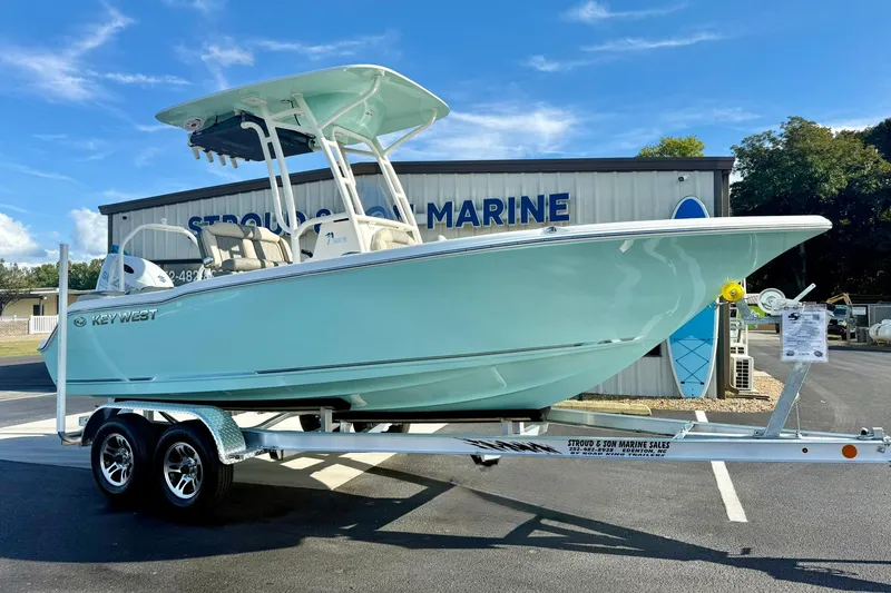 Slide: The Image of 2026 Key West 203 FS boat on trailer at marine dealership. - 4