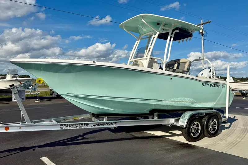 Slide: The Image of 2026 Key West 203 FS boat on trailer under clear blue sky. - 5