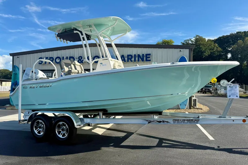 Slide: The Image of 2026 Key West 203 FS boat on trailer at Stroud & Son Marine dealership. - 6