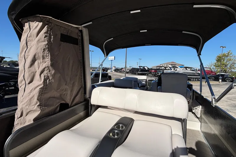 Slide: The Image of 2010 Premier 250 Grand Isle pontoon boat interior with seating and canopy. - 18