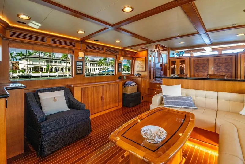 Slide: The Image of Luxurious interior of 2015 Marlow 66E-CB yacht with elegant wood finishes and plush seating. - 14