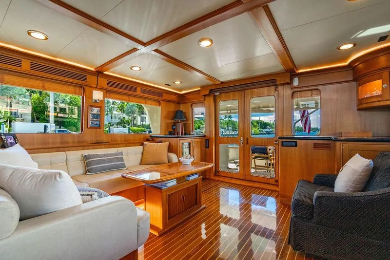 Slide: The Image of Luxurious interior of 2015 Marlow 66E-CB yacht with elegant wood finishes and plush seating. - 15
