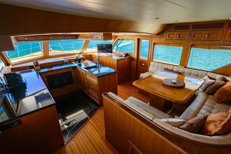 Slide: The Image of Luxurious interior of 2015 Marlow 66E-CB yacht with elegant wood finishes and ocean views. - 17