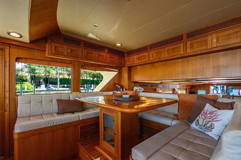 Slide: The Image of Luxurious interior of 2015 Marlow 66E-CB yacht with elegant wood finish and plush seating. - 19