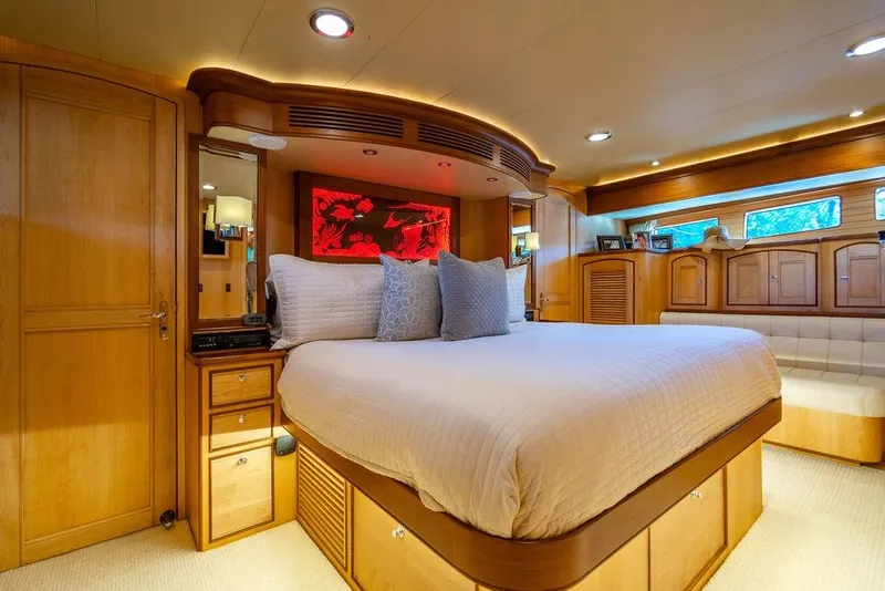 Slide: The Image of Luxurious bedroom interior on 2015 Marlow 66E-CB yacht with elegant wood finishes. - 22