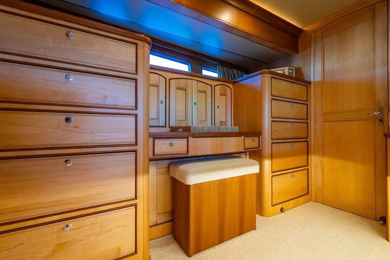 Slide: The Image of Luxurious wooden cabinetry in a 2015 Marlow 66E-CB yacht interior. - 23