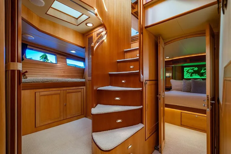 Slide: The Image of Luxurious interior of 2015 Marlow 66E-CB yacht with wooden stairs and cozy bedrooms. - 35