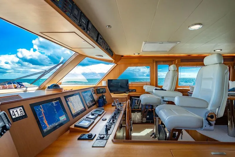 Slide: The Image of Luxurious 2015 Marlow 66E-CB yacht helm with advanced navigation systems and ocean view. - 38