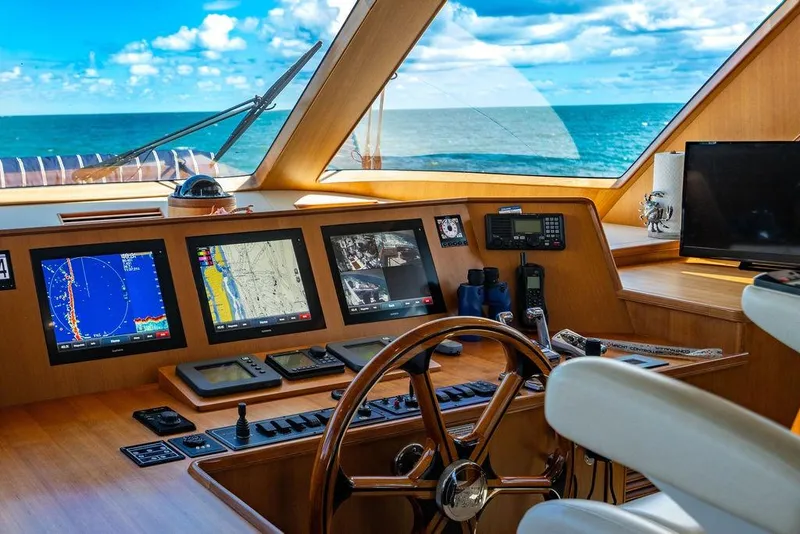 Slide: The Image of Cockpit of 2015 Marlow 66E-CB yacht with navigation screens and ocean view. - 40