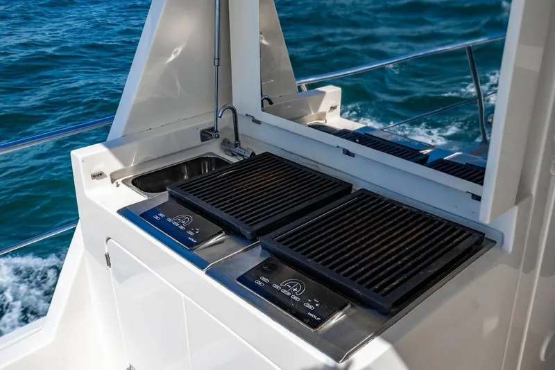 Slide: The Image of Outdoor grill and sink on 2015 Marlow 66E-CB yacht, with ocean view. - 46