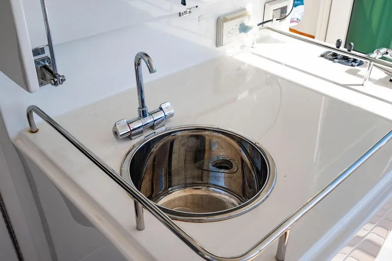 Slide: The Image of Stainless steel sink on 2015 Marlow 66E-CB yacht with modern faucet and countertop. - 47
