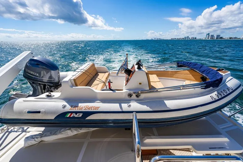 Slide: The Image of 2015 Marlow 66E-CB boat cruising on open water under a clear blue sky. - 50