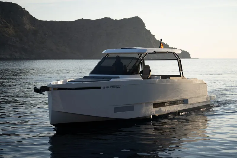 Slide: The Image of 2026 De Antonio Yachts D36 showcased at a boat exhibition, featuring open engine compartment. - 5
