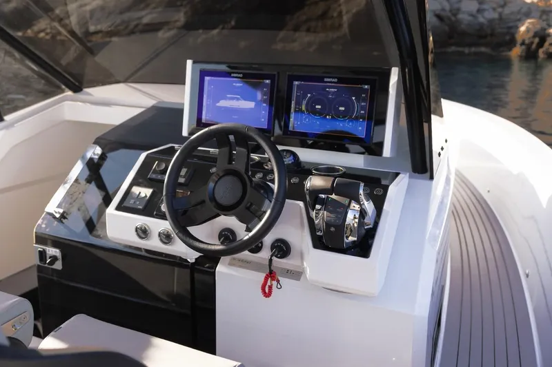 Slide: The Image of Cockpit of 2026 De Antonio Yachts D36 with modern navigation displays and controls. - 14