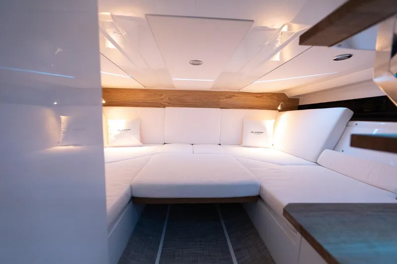Slide: The Image of Luxurious interior cabin of 2026 De Antonio Yachts D36, featuring elegant white seating. - 16