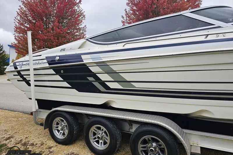 Slide: The Image of 2019 Formula 292 FASTech boat on trailer, parked outdoors near a building. - 15