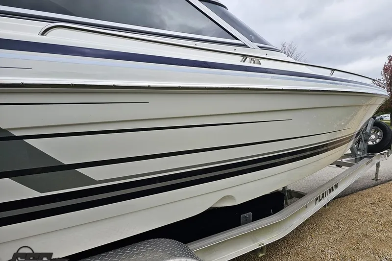 Slide: The Image of 2019 Formula 292 FASTech boat on trailer, parked outdoors. - 17