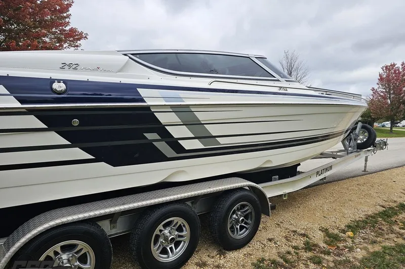Slide: The Image of 2019 Formula 292 FASTech boat on trailer, parked outdoors on a sunny day. - 18