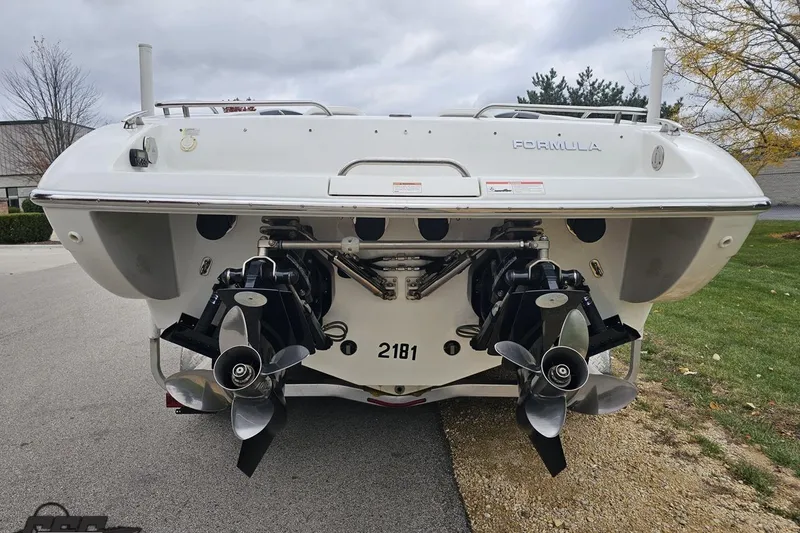 Slide: The Image of 2019 Formula 292 FASTech boat on trailer, parked outdoors under clear blue sky. - 21