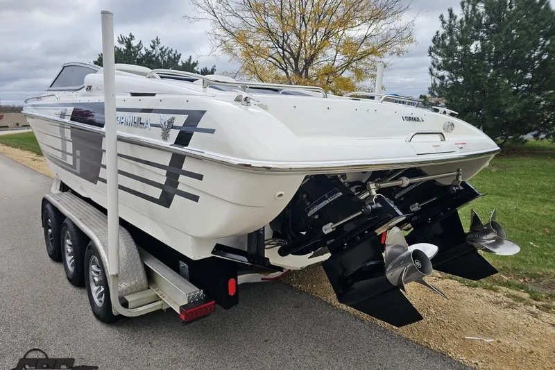 Slide: The Image of 2019 Formula 292 FASTech boat on trailer, sleek design, parked outdoors. - 23