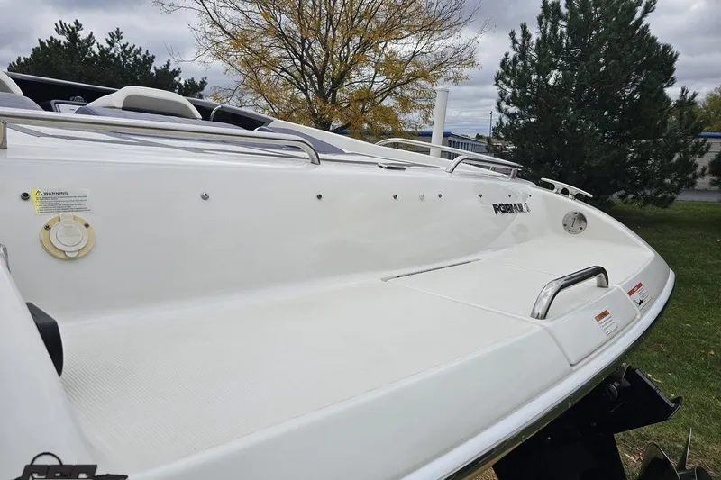 Slide: The Image of 2019 Formula 292 FASTech boat with dual propellers, parked outdoors. - 26