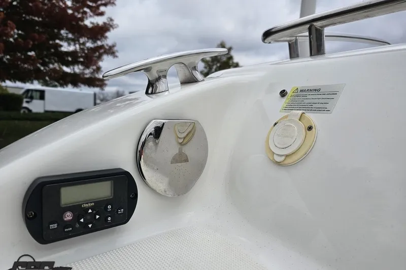 Slide: The Image of 2019 Formula 292 FASTech boat rear view with dual propellers in a parking area. - 27