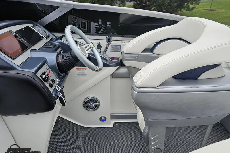 Slide: The Image of 2019 Formula 292 FASTech boat deck with sleek black and white seating. - 43