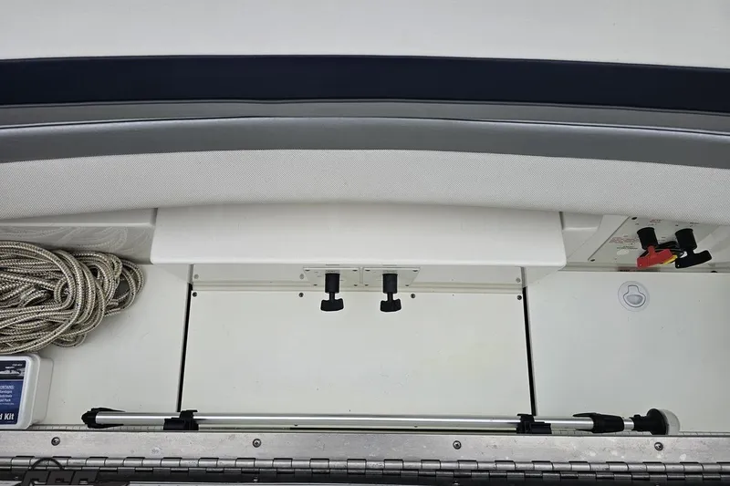 Slide: The Image of 2019 Formula 292 FASTech boat interior with storage compartment and control panel. - 83