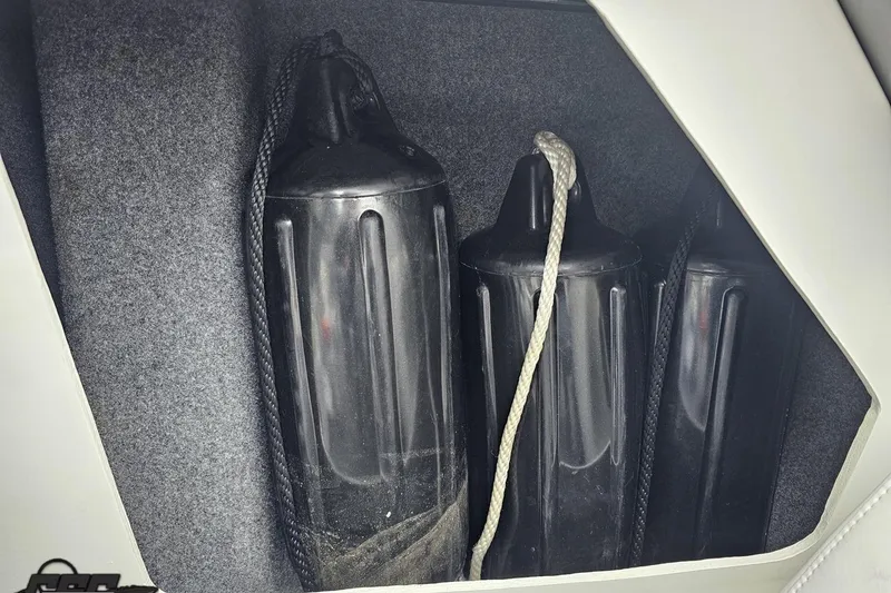 Slide: The Image of Storage compartment with black boat fenders in a 2019 Formula 292 FASTech. - 85