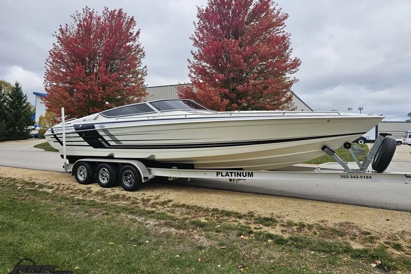 Slide: The Image of 2019 Formula 292 FASTech boat on trailer, sleek design with blue and white graphics. - 9