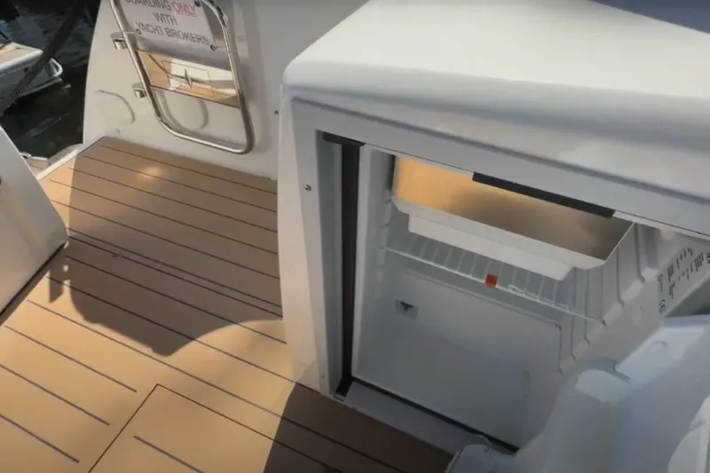 Slide: The Image of 2023 Bavaria R40 Coupe yacht deck with open fridge, showcasing modern design. - 14