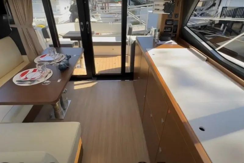 Slide: The Image of Interior of 2023 Bavaria R40 Coupe yacht with elegant dining setup and modern cabinetry. - 18