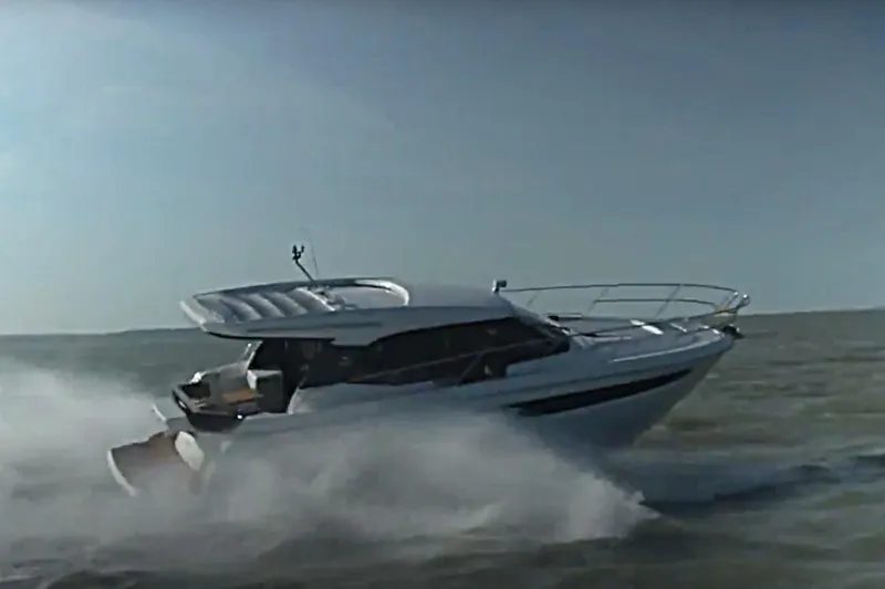 Slide: The Image of 2023 Bavaria R40 Coupe cruising swiftly on open water. - 2