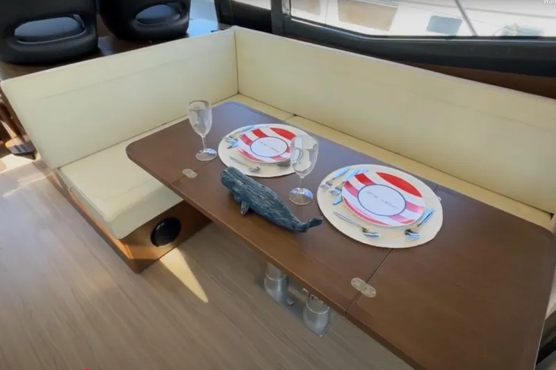 Slide: The Image of Interior of 2023 Bavaria R40 Coupe with elegant dining setup on wooden table. - 21