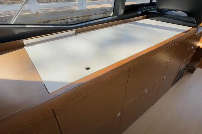 Slide: The Image of 2023 Bavaria R40 Coupe interior with sleek wooden cabinetry and modern design. - 22