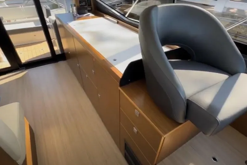 Slide: The Image of Interior of 2023 Bavaria R40 Coupe yacht with modern seating and cabinetry. - 24