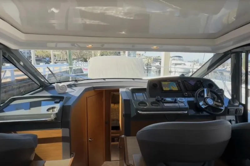 Slide: The Image of Interior view of 2023 Bavaria R40 Coupe yacht cockpit with modern navigation controls. - 25