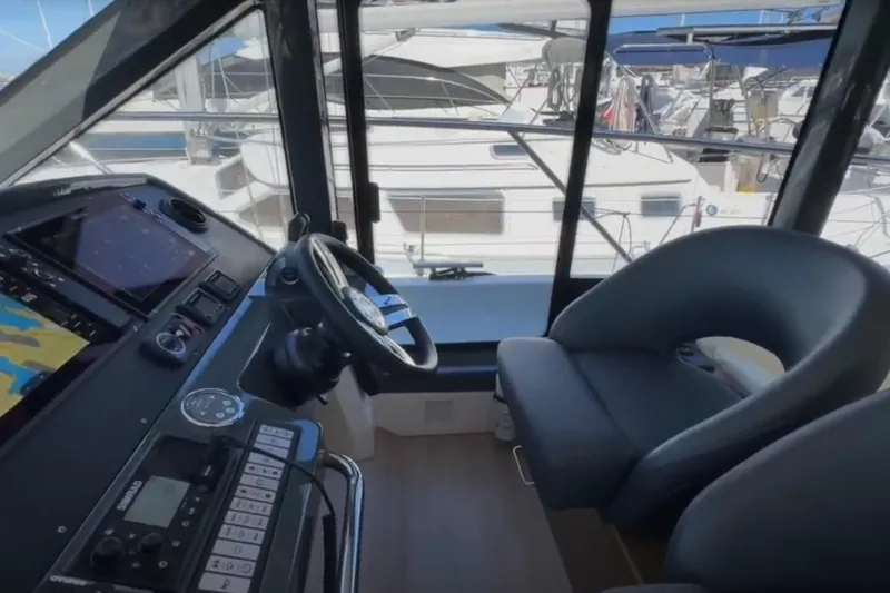 Slide: The Image of Interior of 2023 Bavaria R40 Coupe yacht with modern helm and navigation equipment. - 27