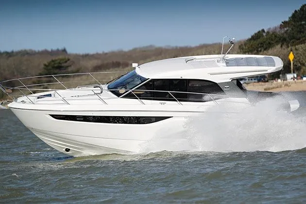 Slide: The Image of 2023 Bavaria R40 Coupe cruising on water, showcasing sleek design and performance. - 3